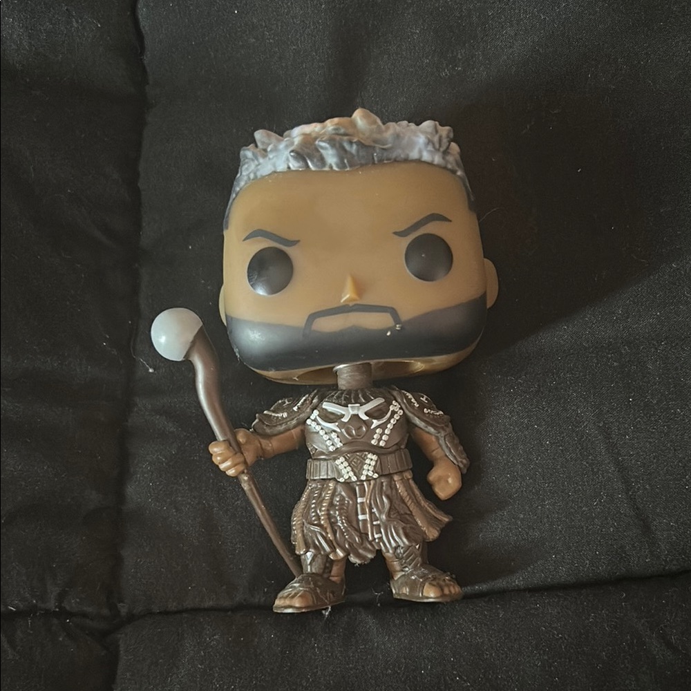 Funko Action Figure with Brown and Silver Armor